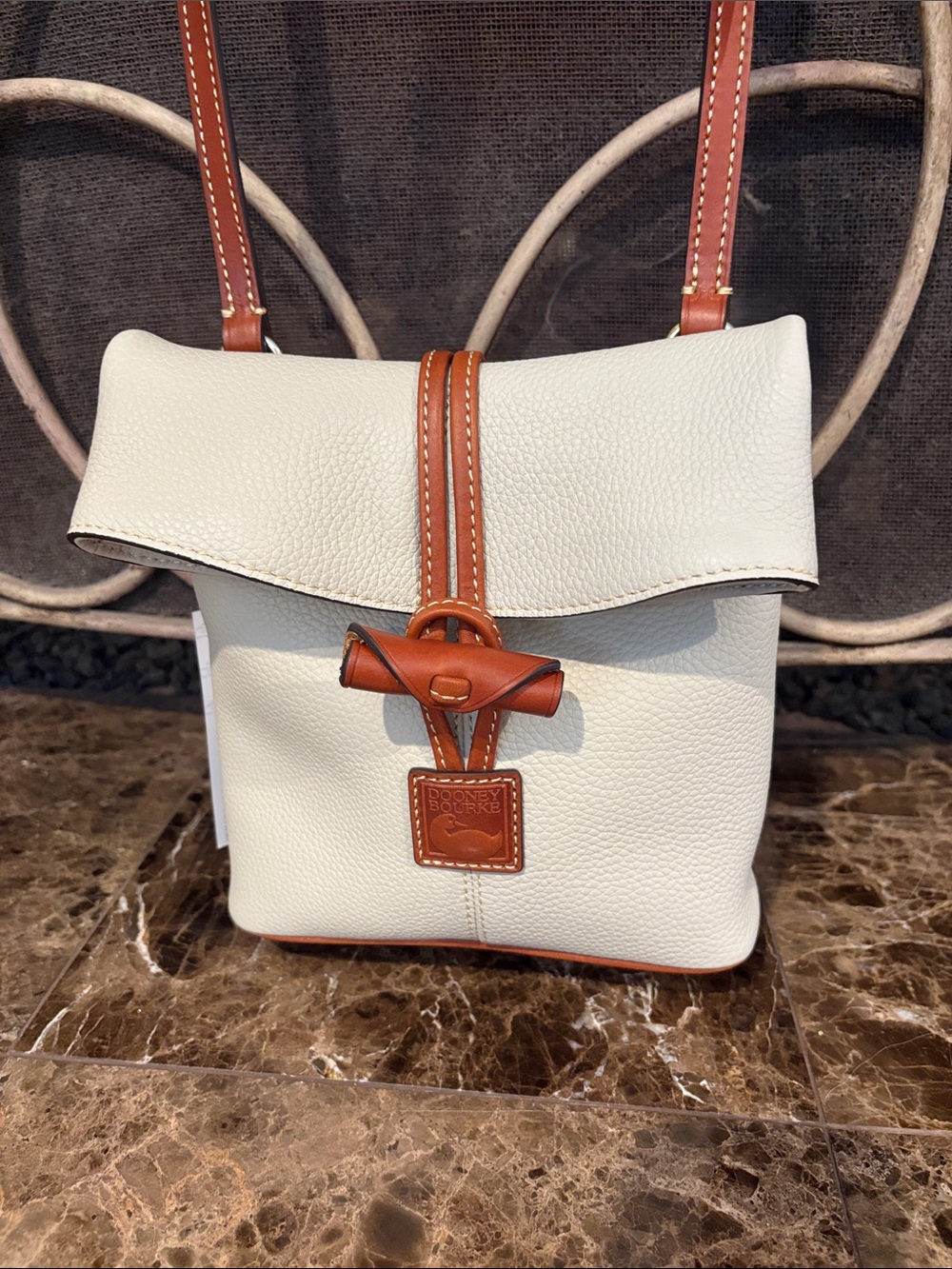 Dooney & Bourke Cream Leather Crossbody with Brown Trim and Toggle Closure